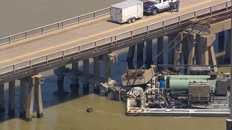 Barge hits Texas bridge connecting Galveston and Pelican Island, causing partial collapse and oil spill